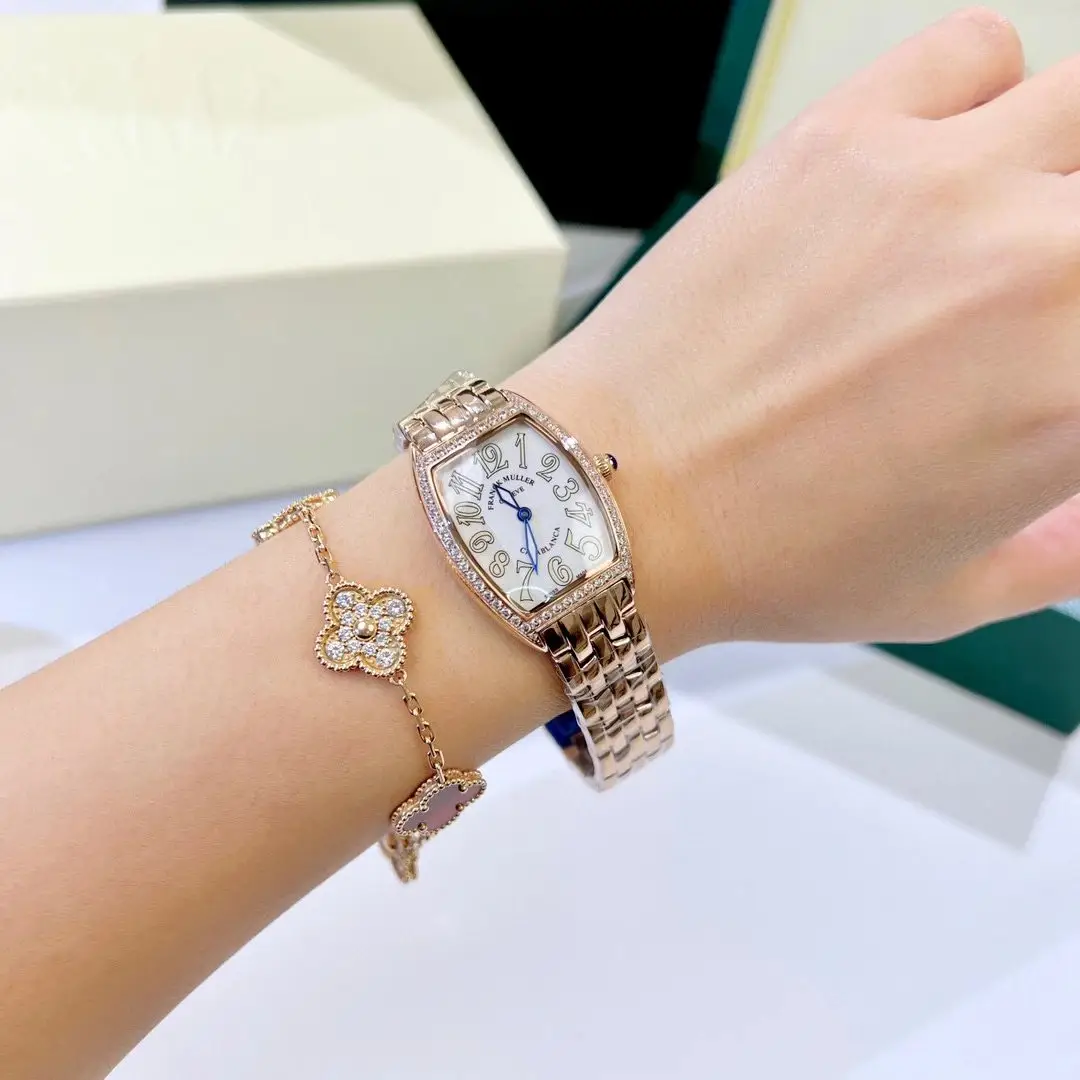 Diamond-set bezel detail of barrel-shaped watch