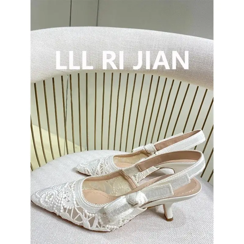 Elegant white stiletto heels sole view