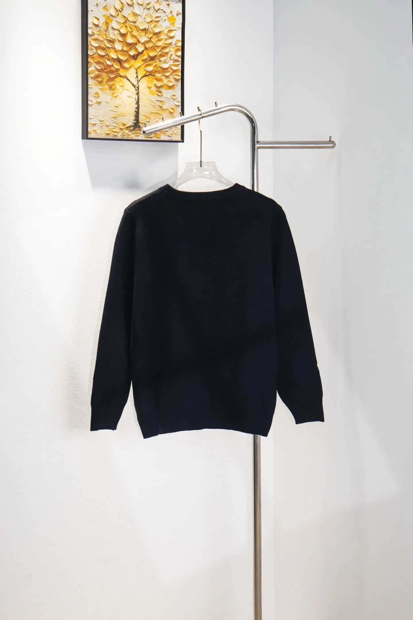 Black sweater back view